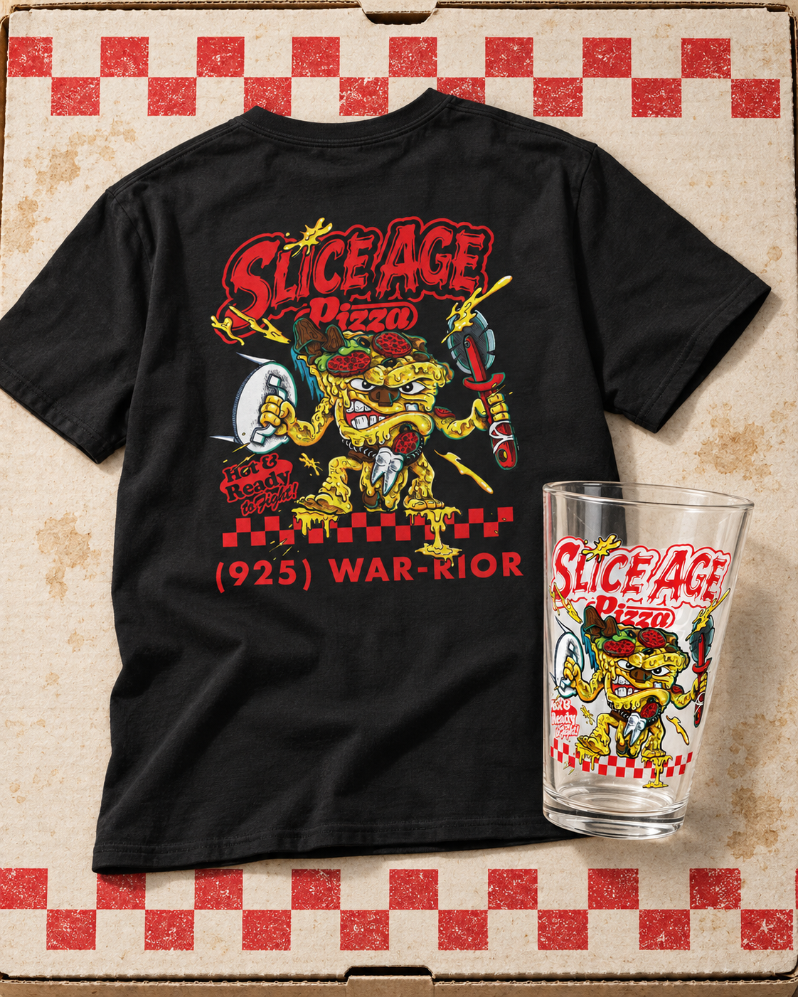 Slice Age Pizza graphic T-shirt and collectible pint glass on a pizza box